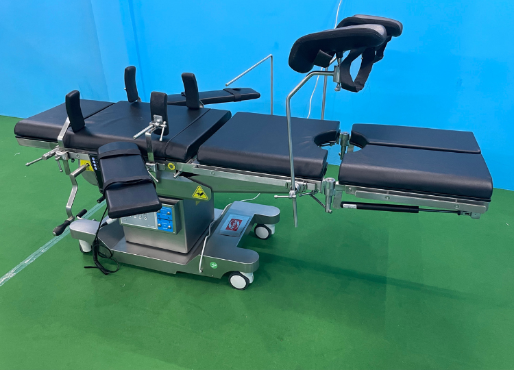 ELECTRO MANUAL CARM OT TABLE WITH CENTER LOCKING WHEELS